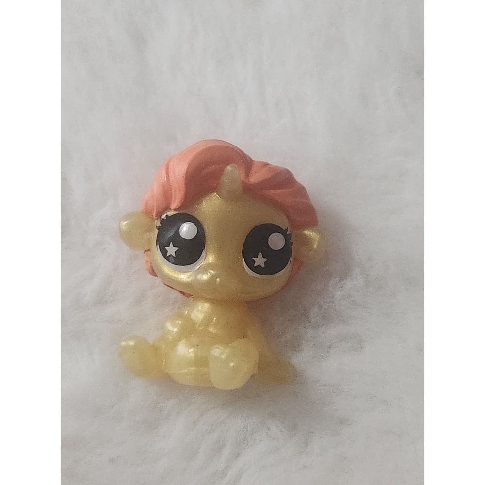 miniature figure is a Zuru Rainbowcorns Lion Pencil Topper
